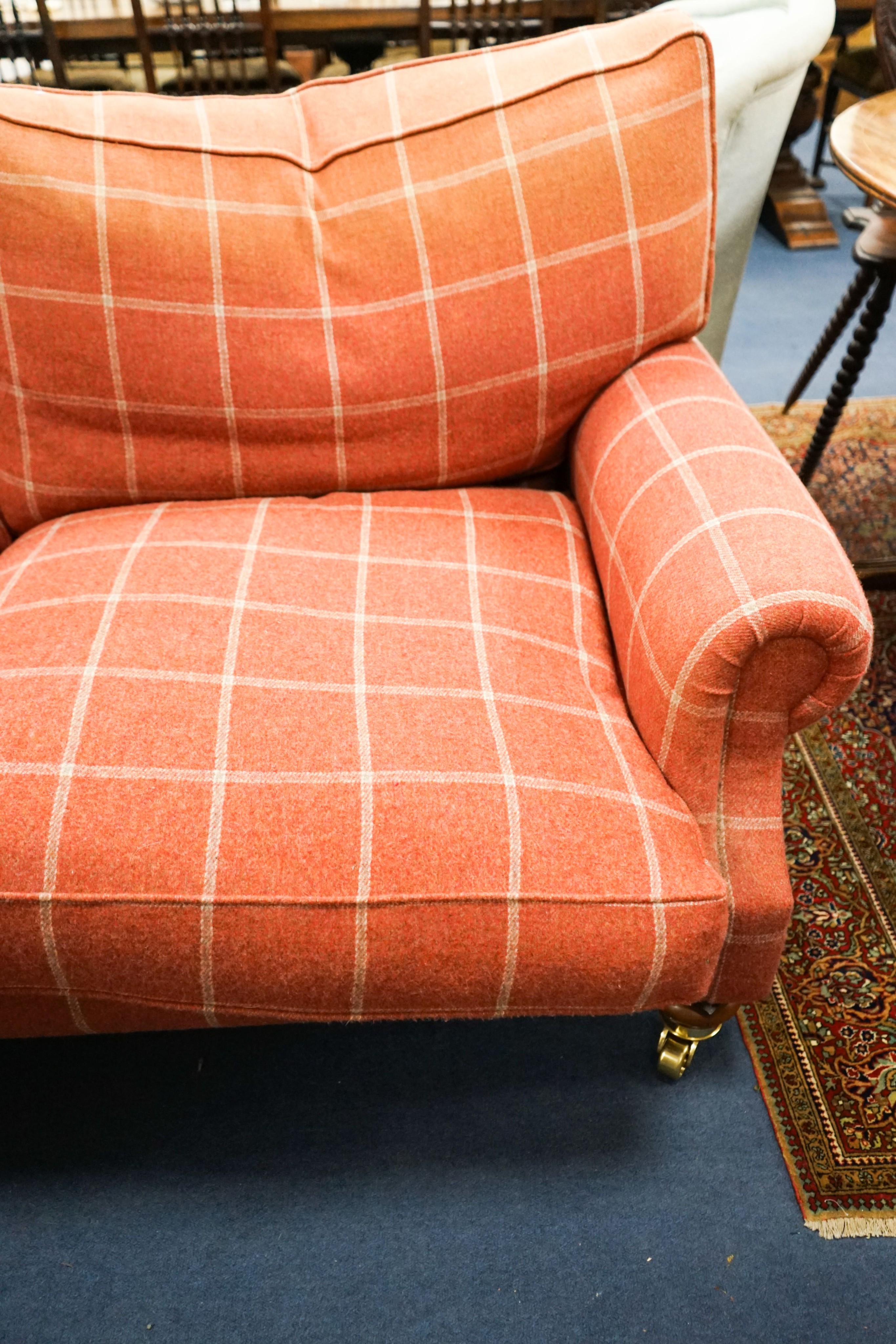 A contemporary patterned red fabric two seater settee, length 180cm, depth 100cm, height 92cm